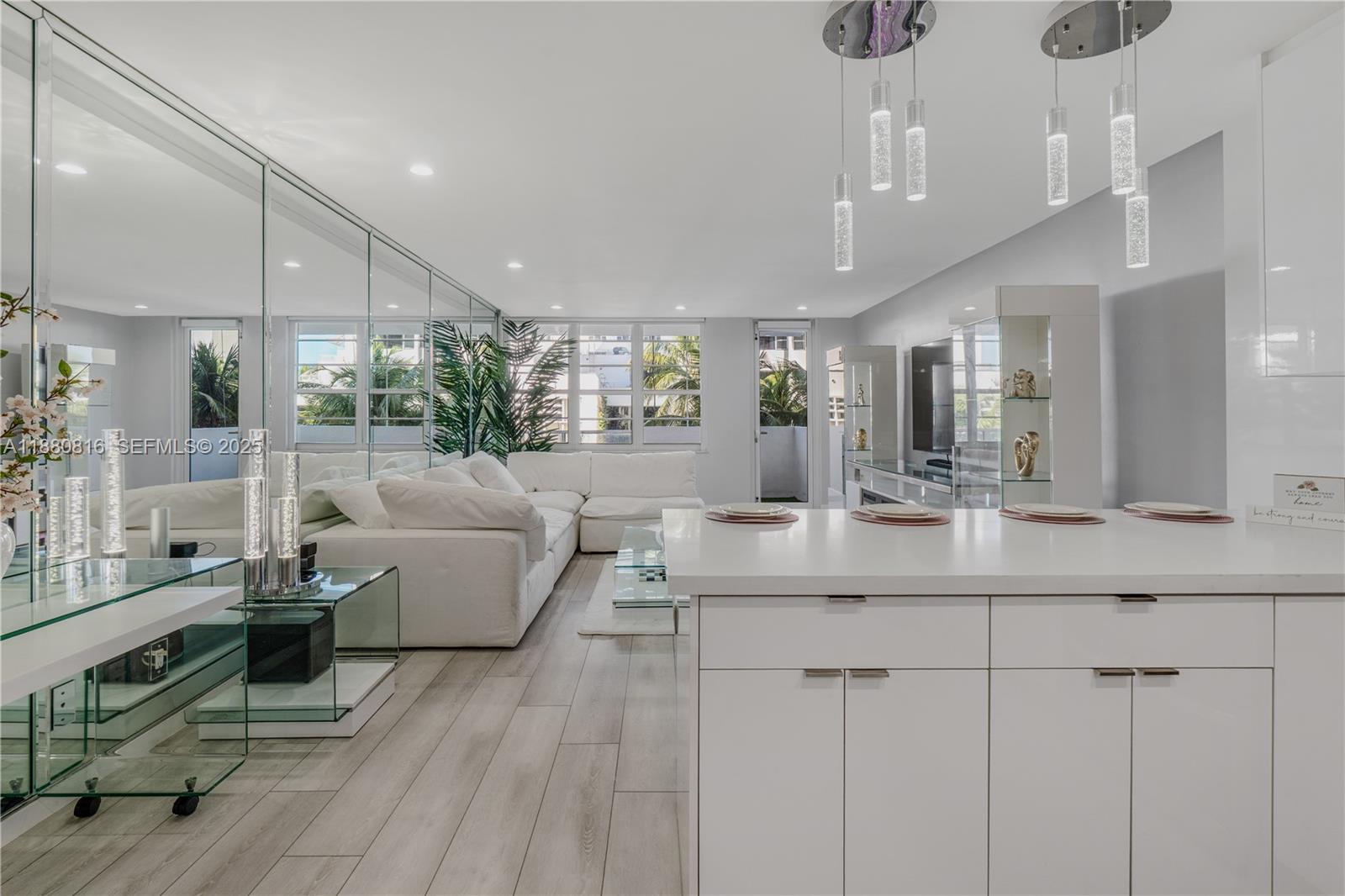 100 Lincoln Road, Unit 323 Miami Beach, FL 33139 - Photo 5 of 59 a living room with furniture and a wooden floor