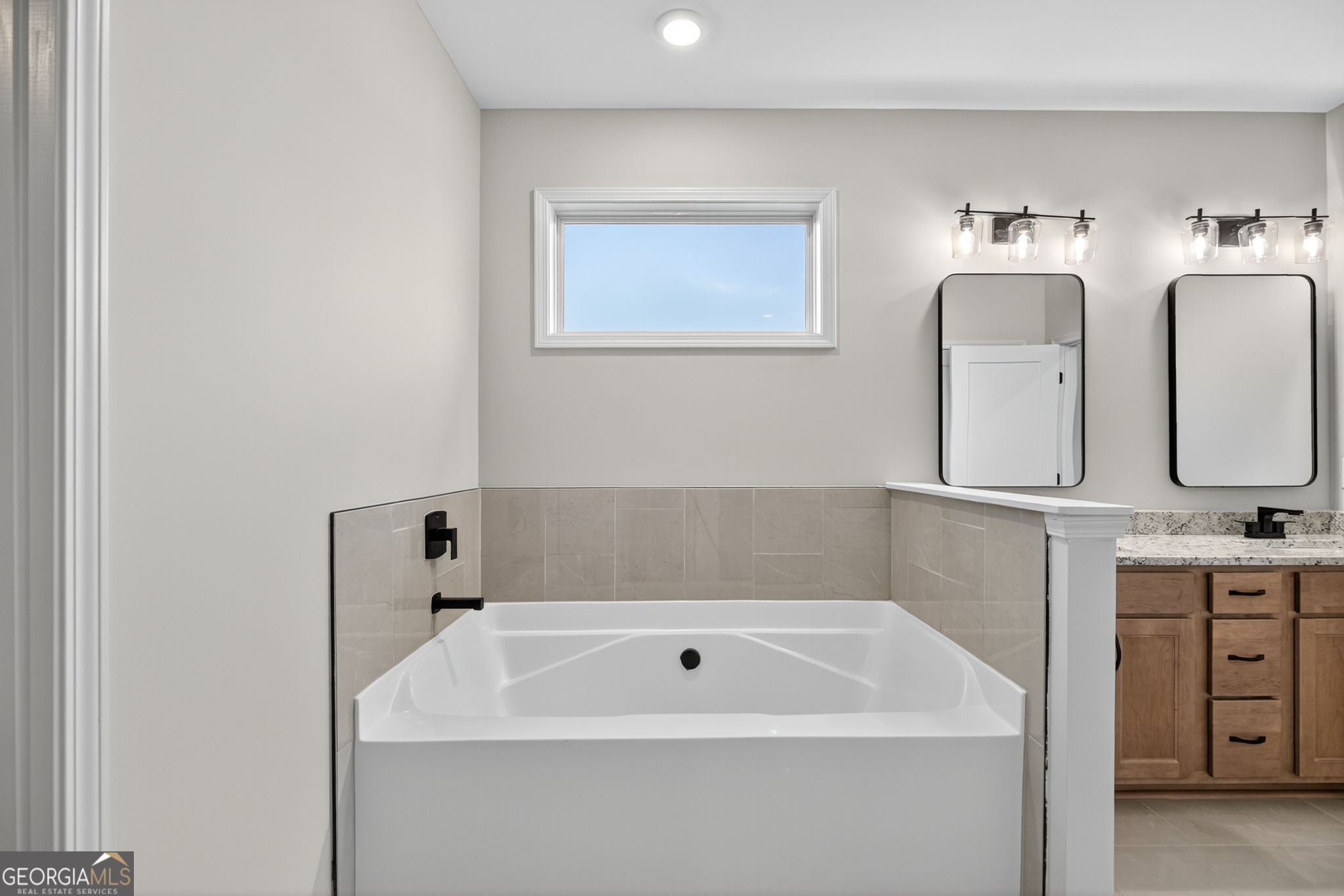359 Gray Road Roopville, GA 30170 - Photo 32 of 46 a bathroom with a bathtub and a sink