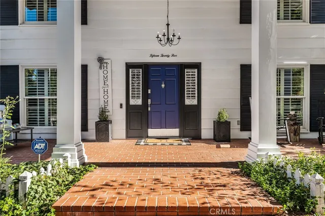 a view of a building with potted plants