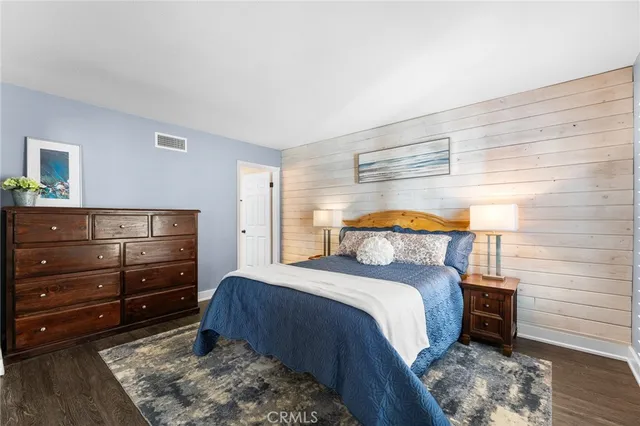 a bedroom with a bed and a dresser