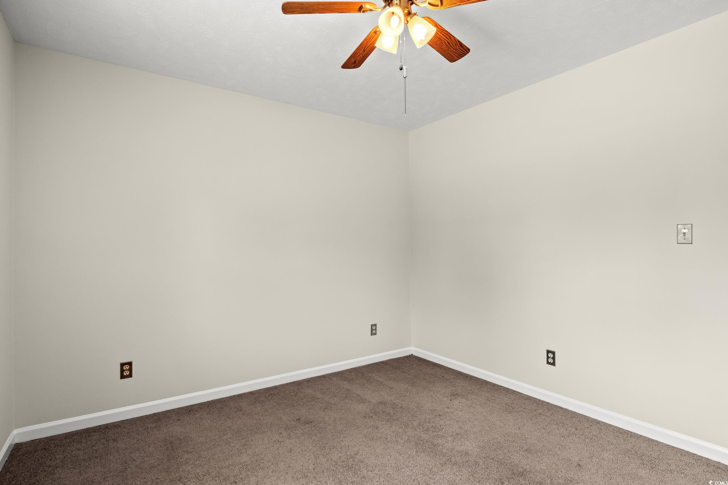 1025 Carolina Road, Unit S2 Conway, SC 29526 - Photo 14 of 27 Spare room featuring carpet flooring and ceiling f