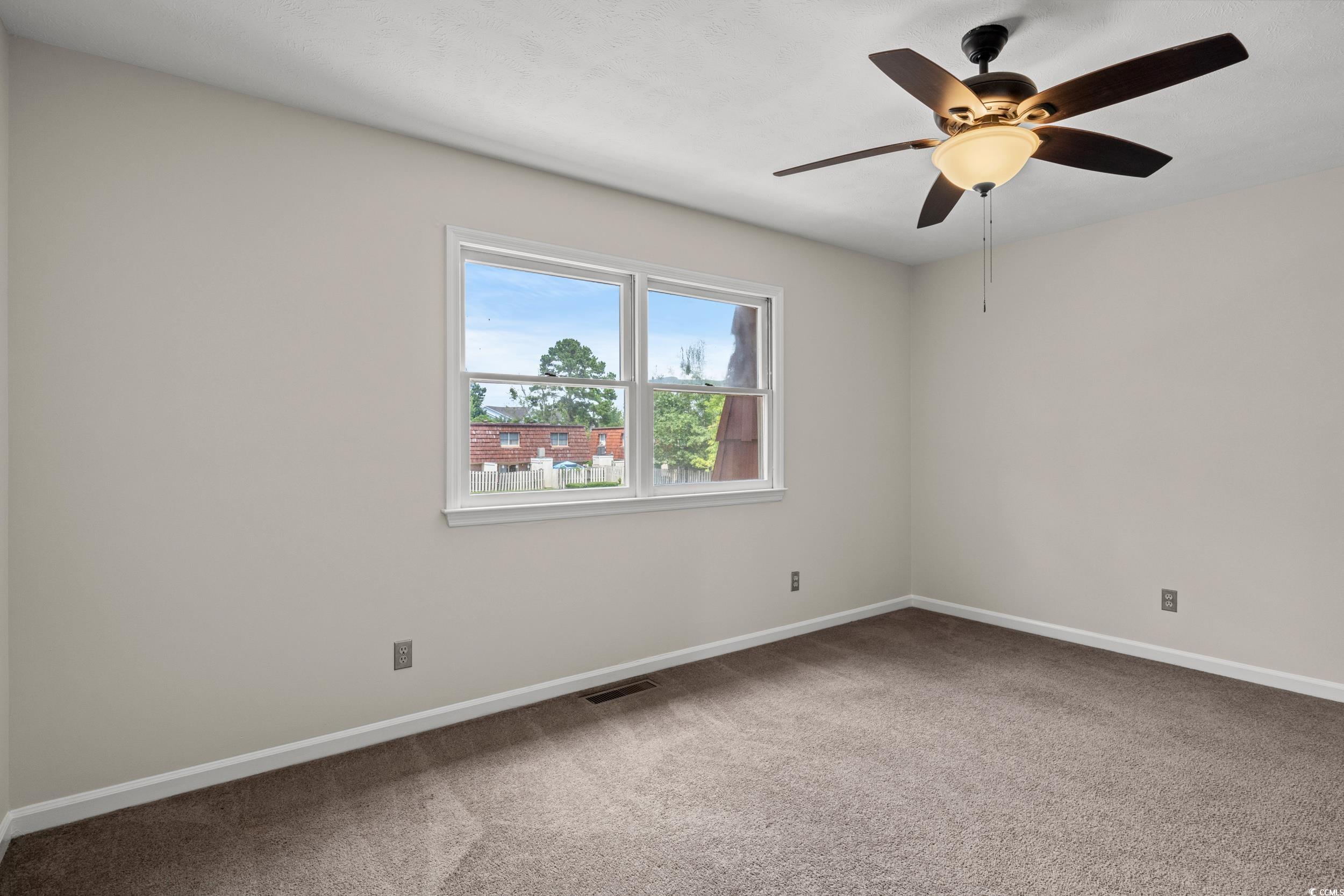 1025 Carolina Road, Unit S2 Conway, SC 29526 - Photo 16 of 27 Carpeted spare room with ceiling fan