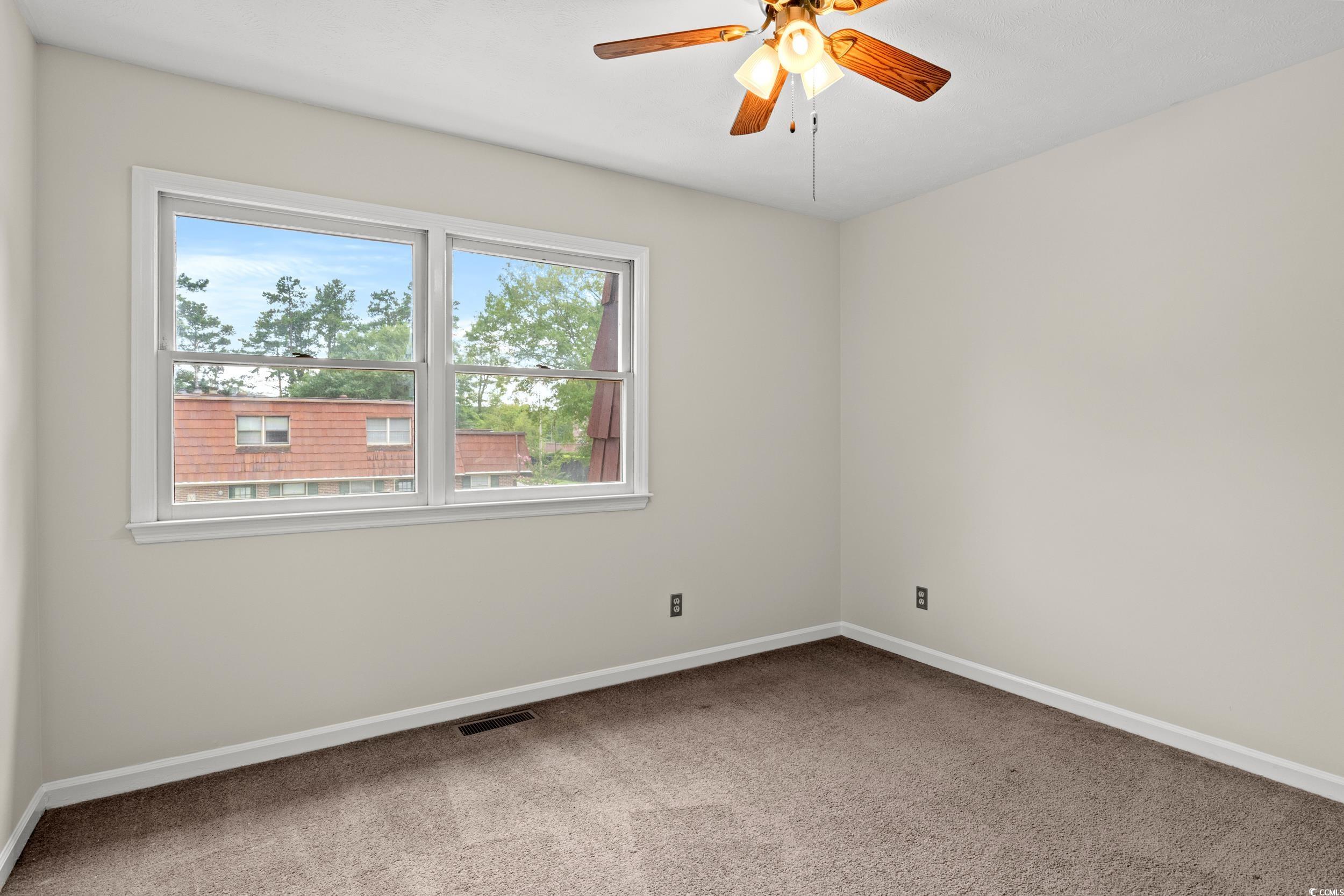1025 Carolina Road, Unit S2 Conway, SC 29526 - Photo 17 of 27 Carpeted empty room featuring ceiling fan
