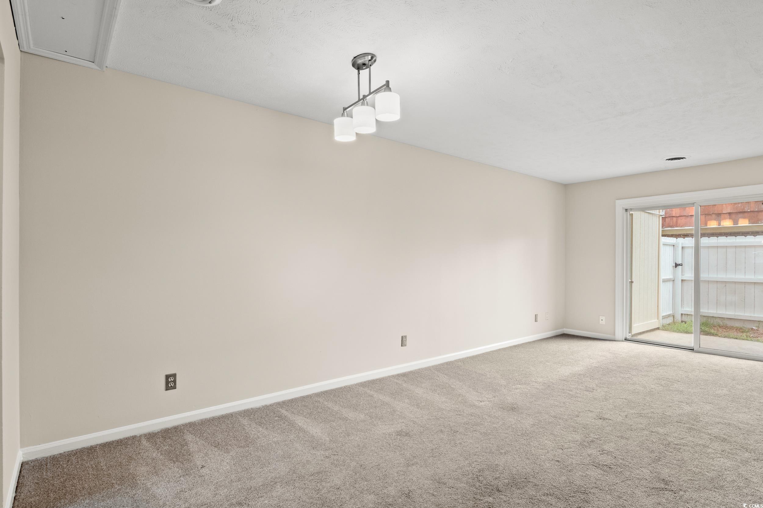 1025 Carolina Road, Unit S2 Conway, SC 29526 - Photo 9 of 27 View of carpeted empty room