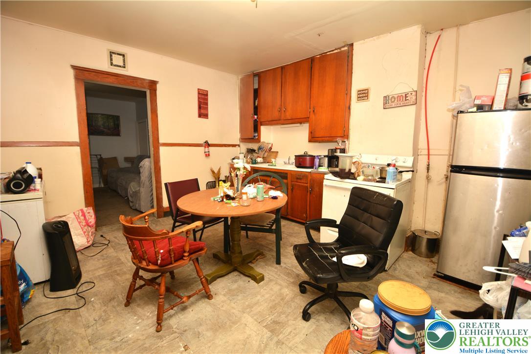 745 Main Street Kingston, PA 18704 - Photo 12 of 15 a view of a dining room with furniture window and wooden floor