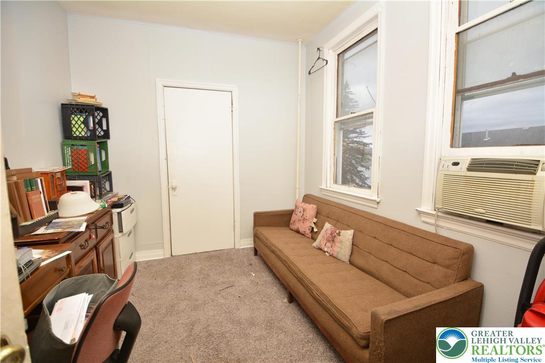 745 Main Street Kingston, PA 18704 - Photo 14 of 15 a living room with furniture and a window