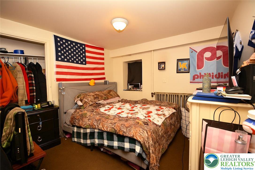 745 Main Street Kingston, PA 18704 - Photo 6 of 15 a bedroom with a bed and a closet