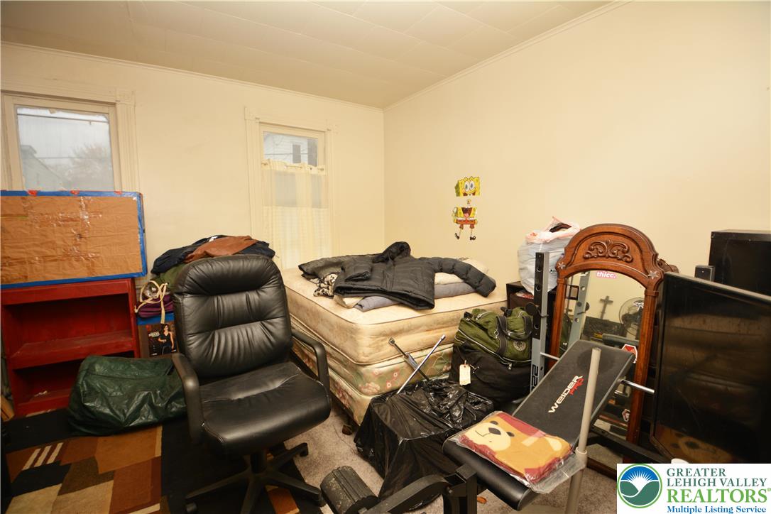 745 Main Street Kingston, PA 18704 - Photo 10 of 15 a bedroom with a bed and dresser