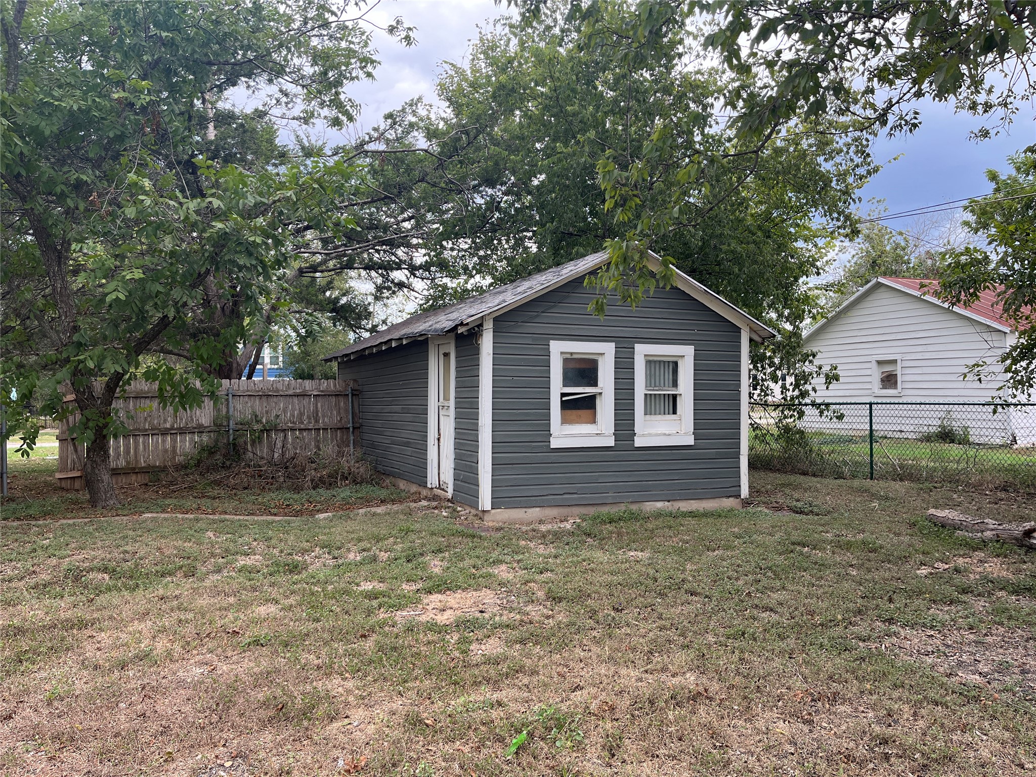 246 West Clark Street Bartlett, TX 76511 - Photo 15 of 16 a house with a tree in front of the house