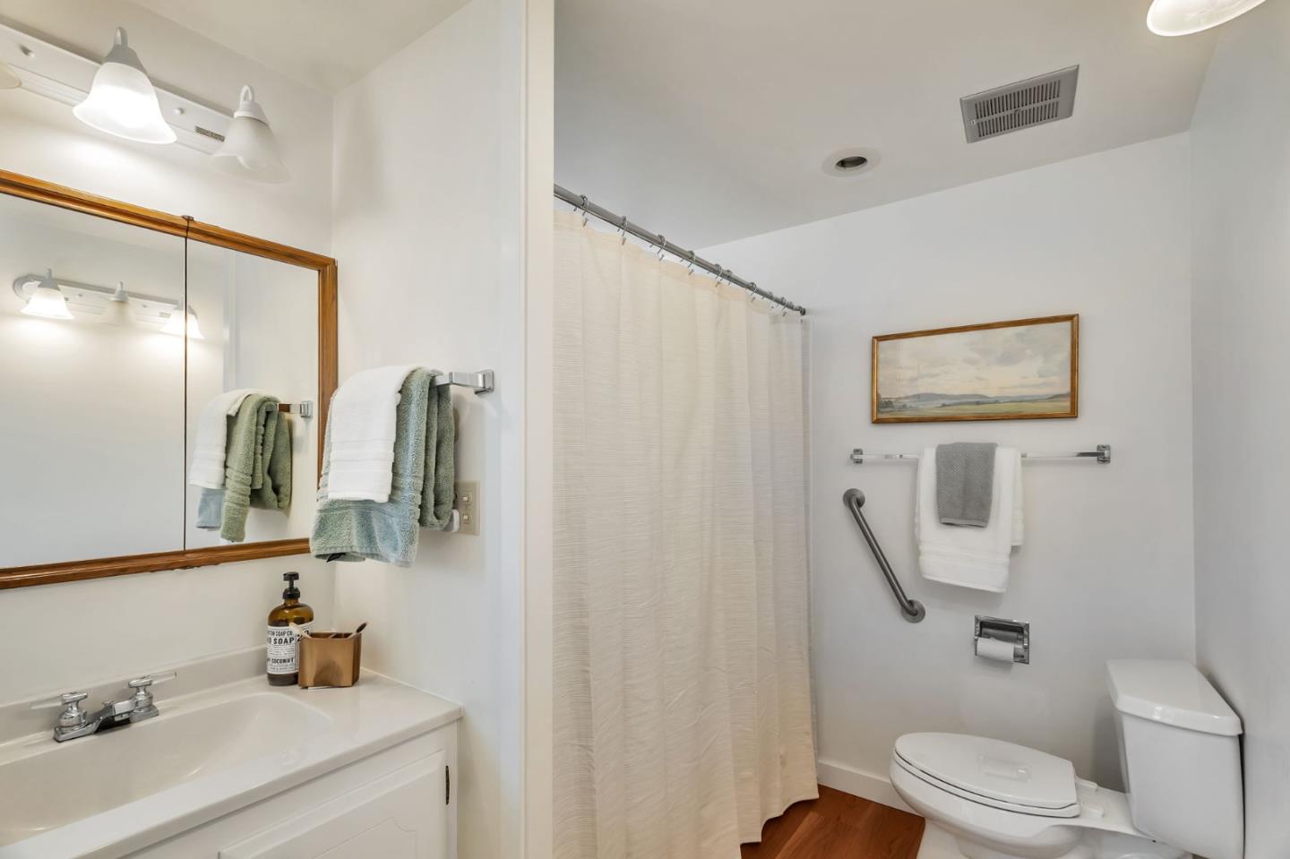 225 Mt Hermon Road, Unit 81 Scotts Valley, CA 95066 - Photo 14 of 38 a bathroom with a sink toilet and mirror
