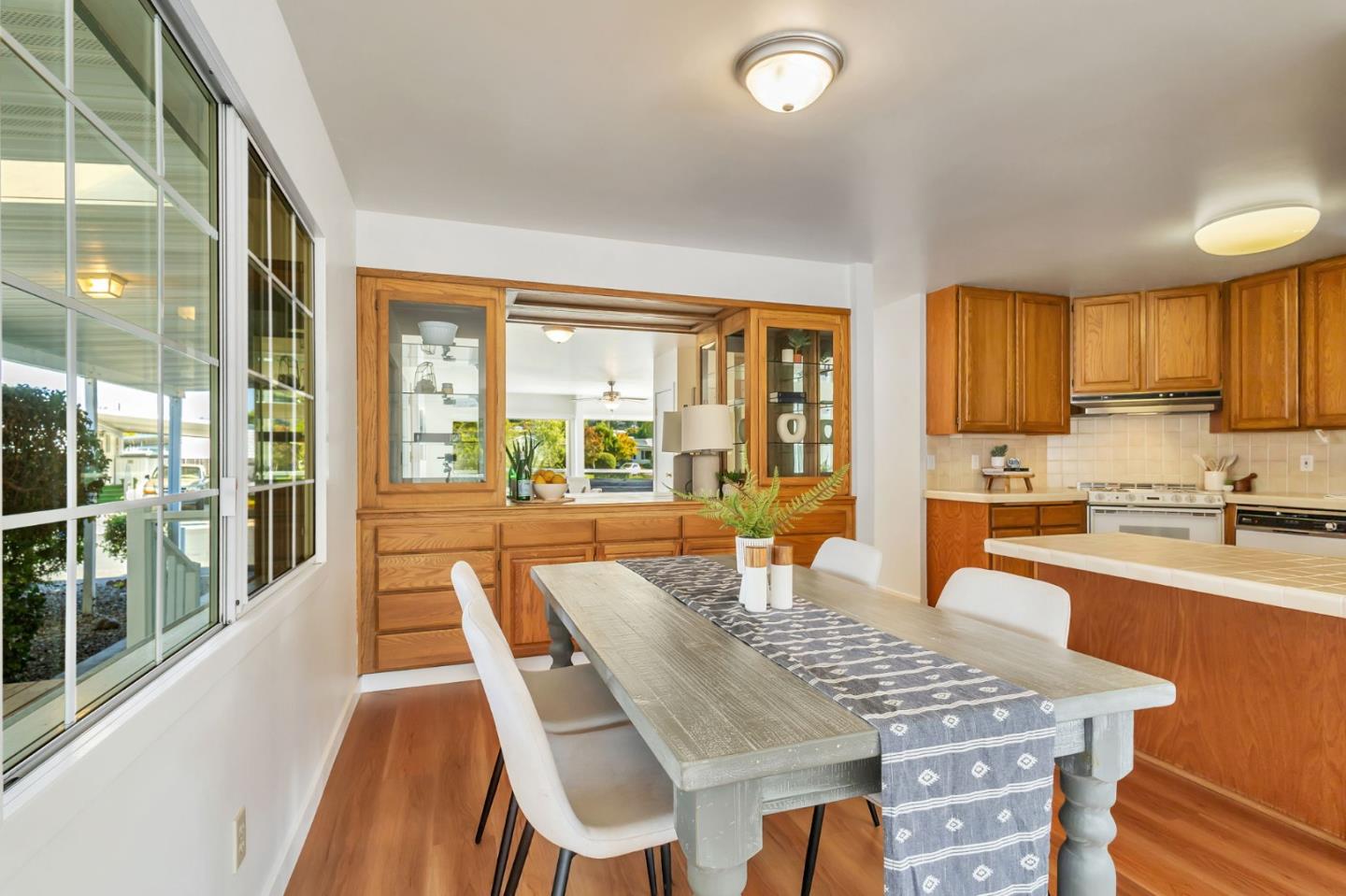 225 Mt Hermon Road, Unit 81 Scotts Valley, CA 95066 - Photo 18 of 38 a view of a dining room with furniture large windows and wooden floor