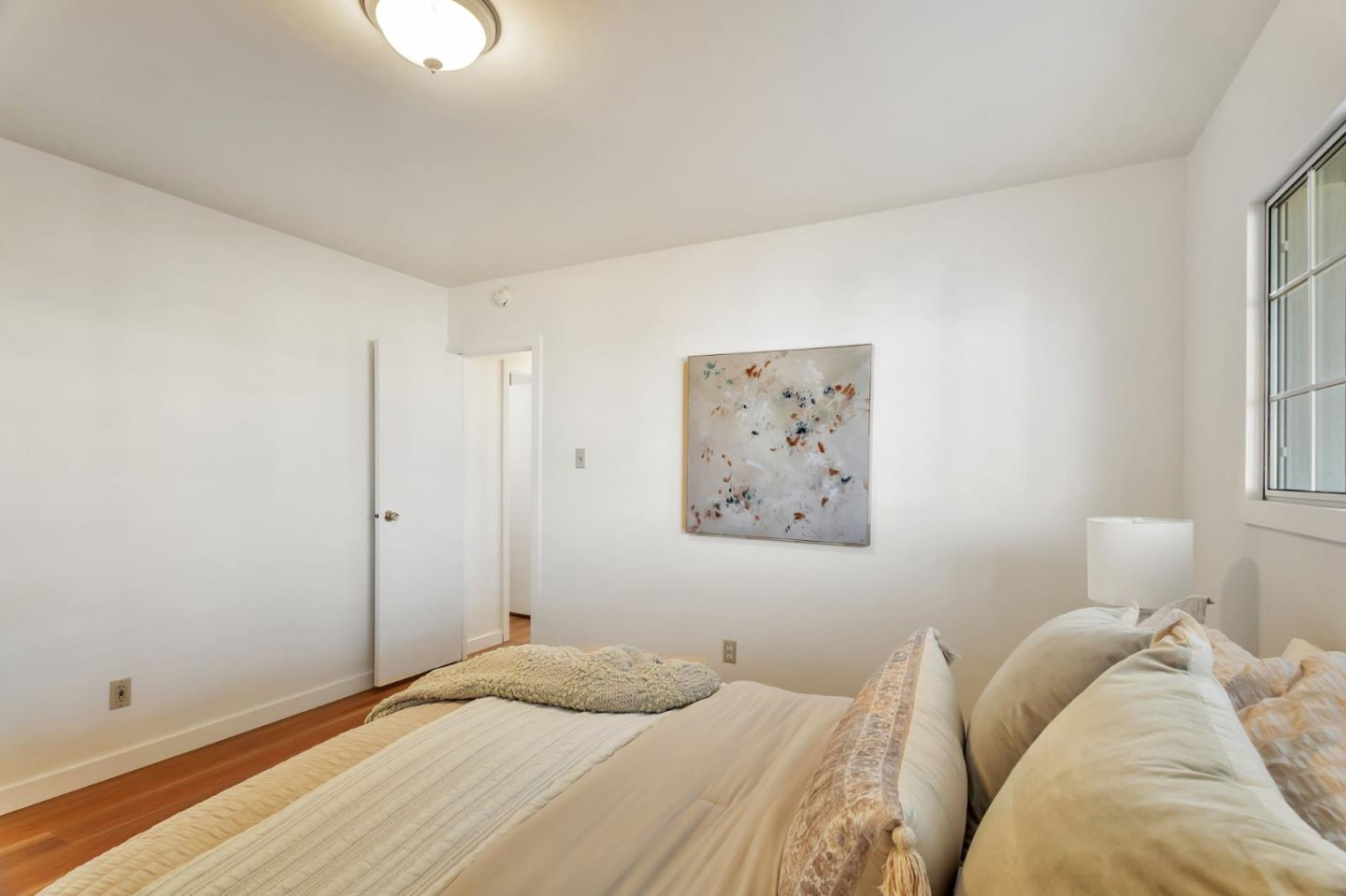 225 Mt Hermon Road, Unit 81 Scotts Valley, CA 95066 - Photo 23 of 38 a bedroom with a bed and a window