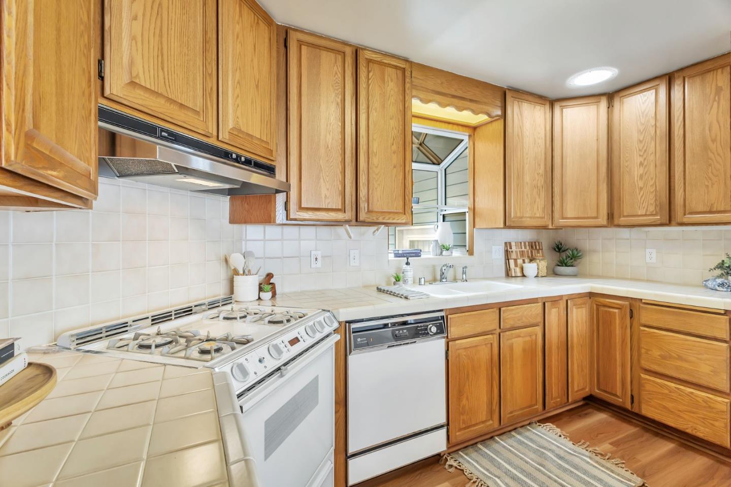 225 Mt Hermon Road, Unit 81 Scotts Valley, CA 95066 - Photo 37 of 38 a kitchen with a sink stove and cabinets