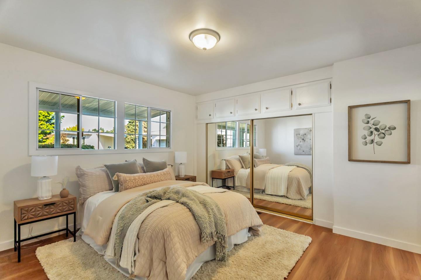 225 Mt Hermon Road, Unit 81 Scotts Valley, CA 95066 - Photo 7 of 38 a bed room with a bed and a painting