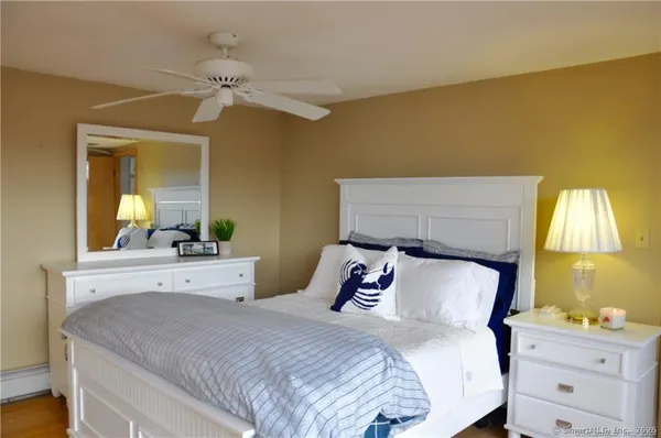 a view of a chairs and table in patio with lake view
