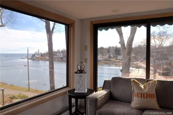 a living room with furniture and a window