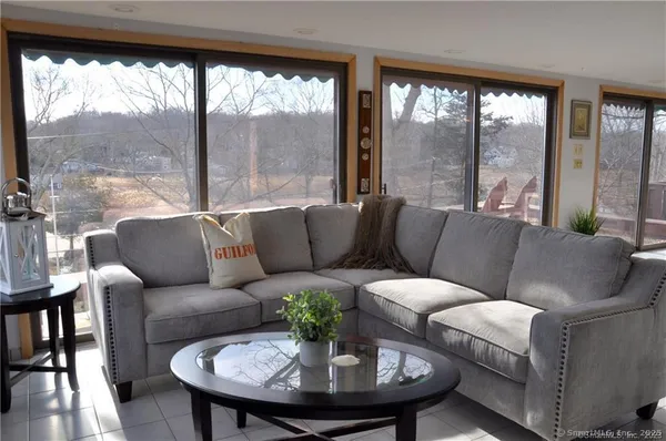 a living room with furniture and a large window