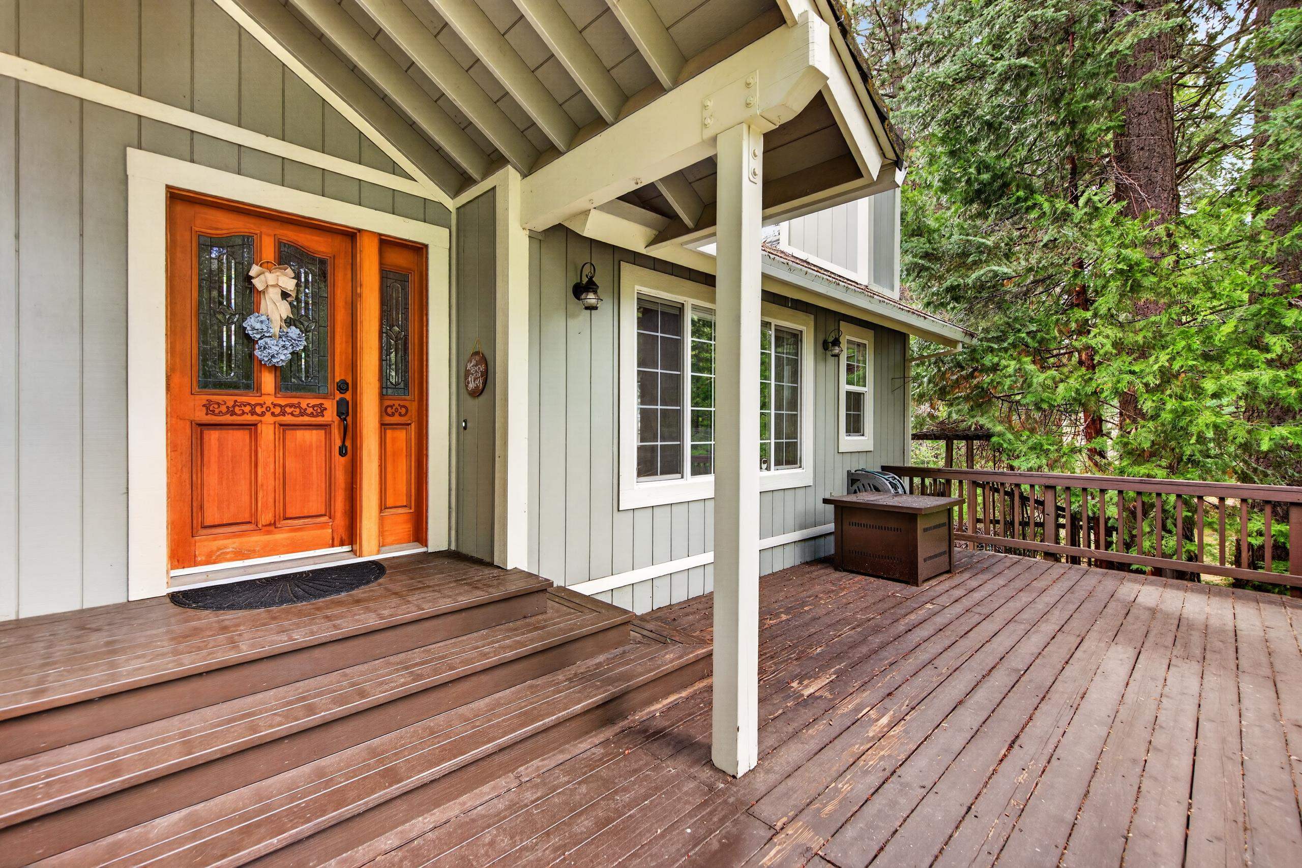 1220 Lynx Road Lake Almanor, CA 96137 - Photo 5 of 45 a view of a house with backyard and deck