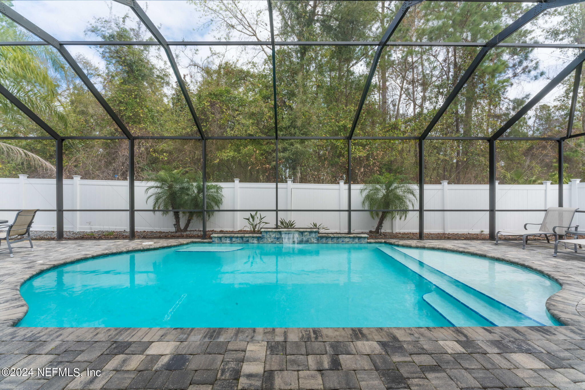 a swimming pool with outdoor outdoor seating and yard