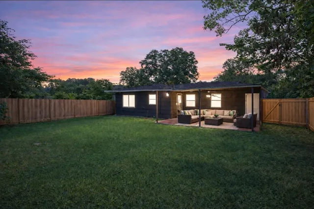 a view of a couches in backyard of house