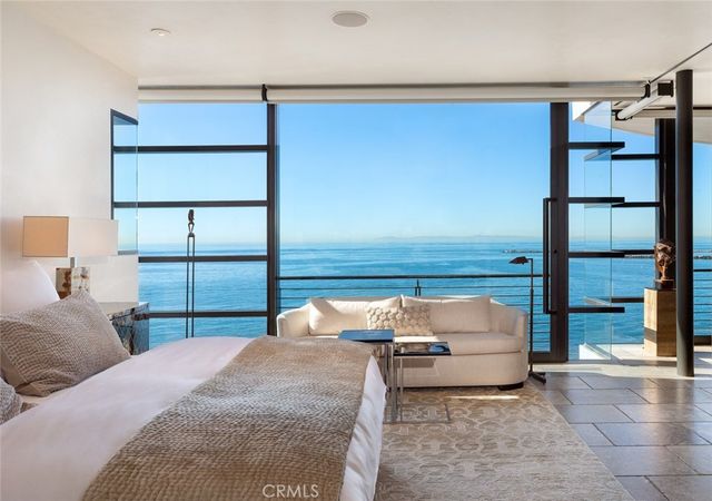 a living room with furniture and a mirror