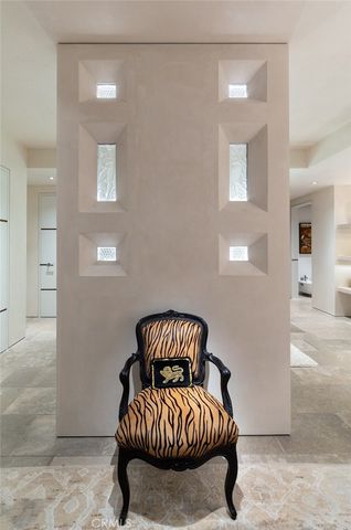 a large white kitchen with a large window and refrigerator