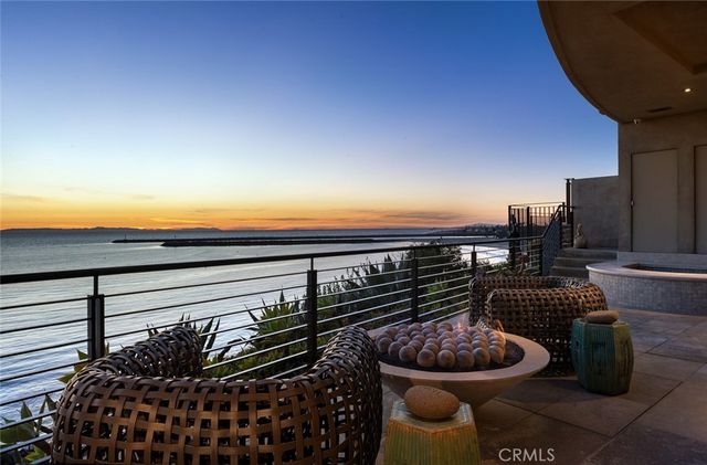 a view of a porch with dining table and chairs