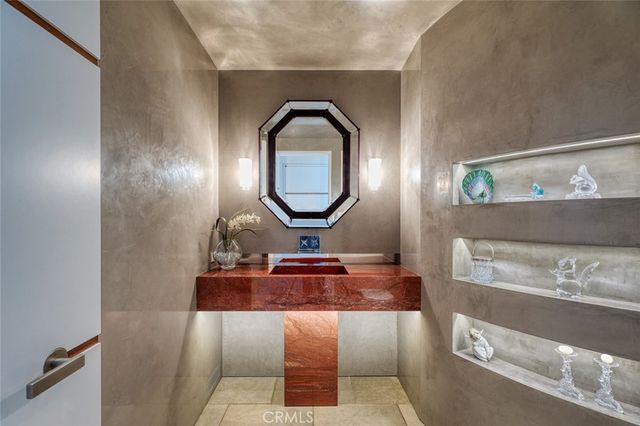 an aerial view of a balcony with chairs