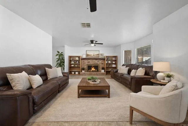 a kitchen with stainless steel appliances granite countertop a refrigerator and a stove