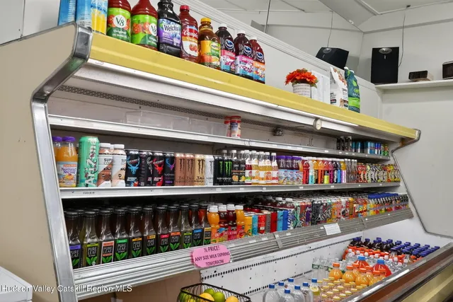 a storage room with washer and lots of wooden racks