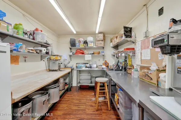 a kitchen with stainless steel appliances granite countertop a stove and a refrigerator