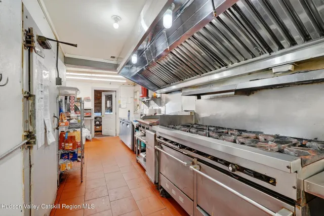 an aerial view of a houses with yard