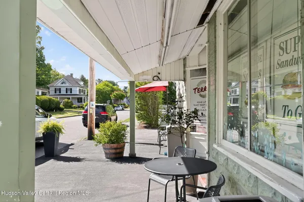 a view of an chairs and table in the patio