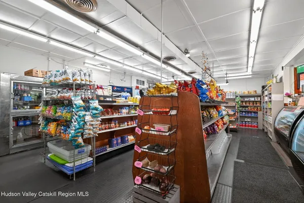 a room with lots of wooden furniture and lots of racks
