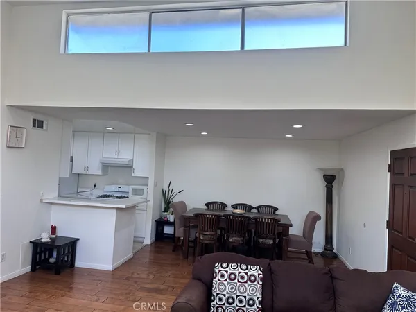 a kitchen with stainless steel appliances cabinets and a table