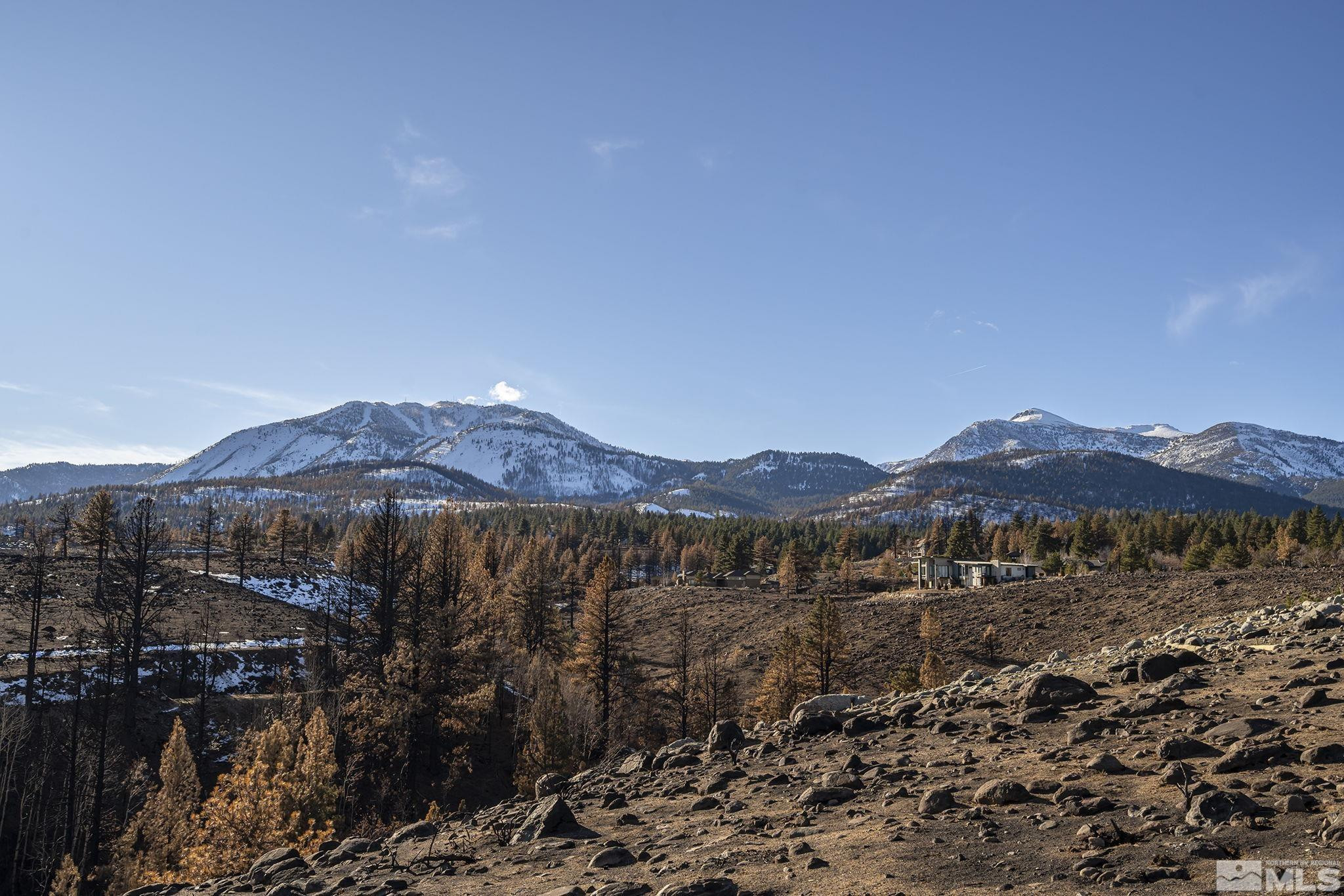 229 South Earlham Court Reno, NV 89511 - Photo 2 of 13 a view of a town with mountains in the background