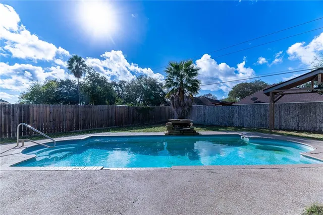 an aerial view of a house with a yard and potted plants