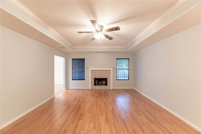 a view of a room window and wooden floor