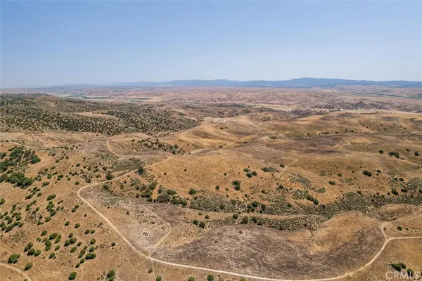 an aerial view of beach and city