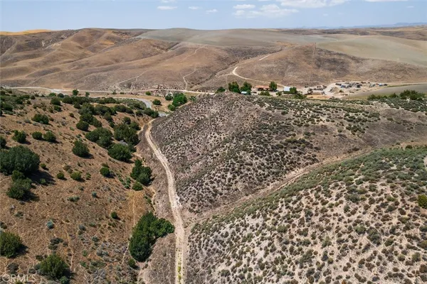 an aerial view of residential house and green space