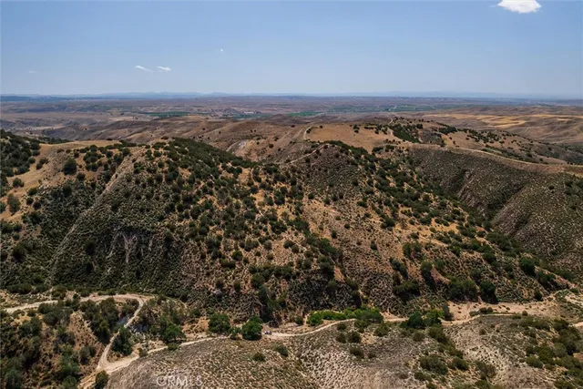 an aerial view of mountain with beach