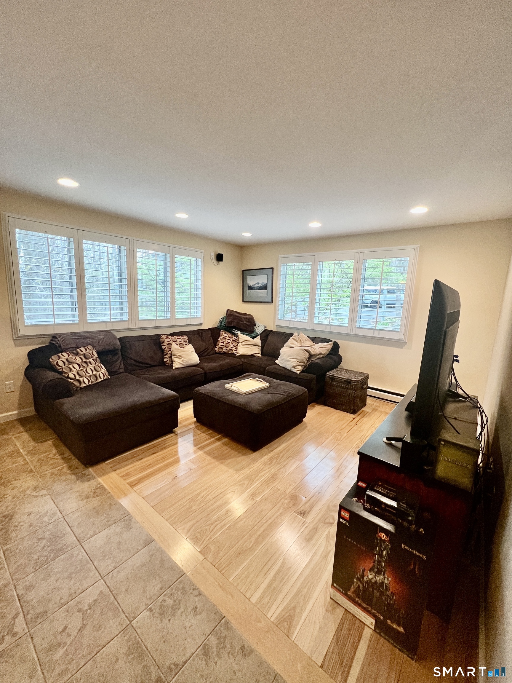 305 Cliffside Drive Torrington, CT 06790 - Photo 3 of 25 a large bedroom with a bed and wooden floor