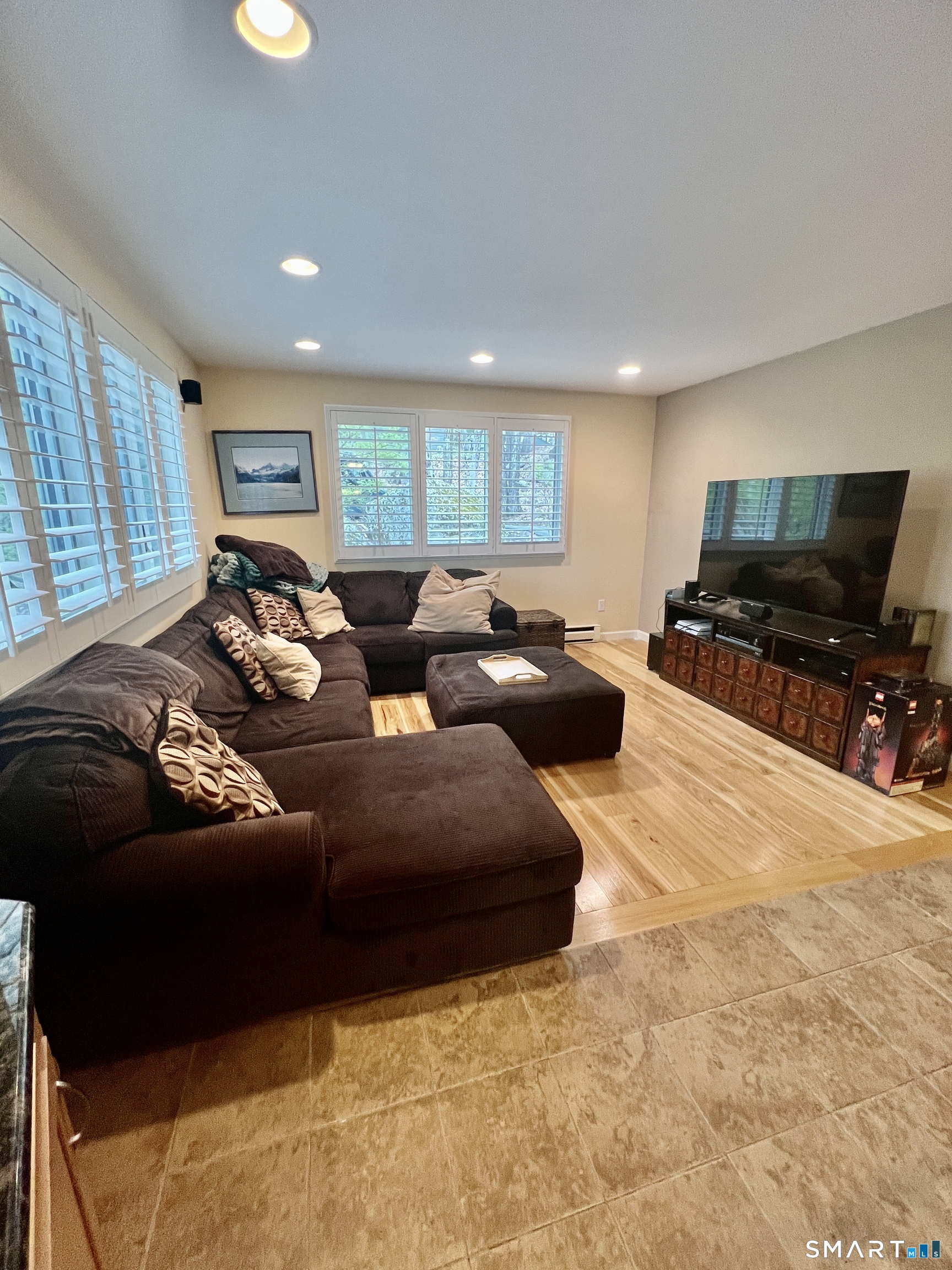 305 Cliffside Drive Torrington, CT 06790 - Photo 4 of 25 a living room with furniture and a flat screen tv