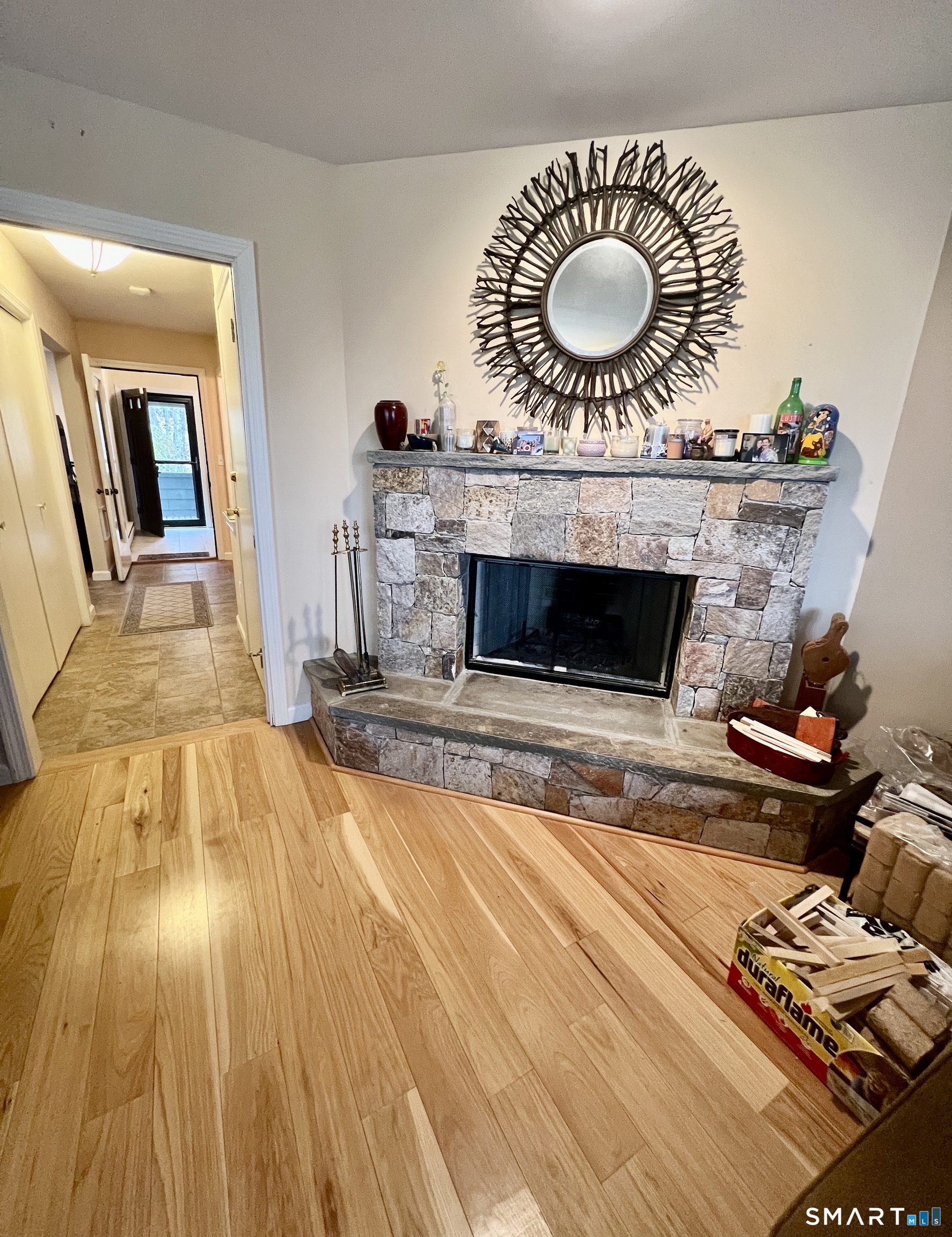 305 Cliffside Drive Torrington, CT 06790 - Photo 8 of 25 a living room with furniture and a fireplace