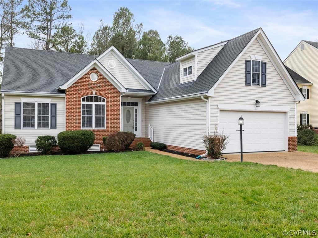 14713 Collington Turn Midlothian, VA 23112 - Photo 1 of 27 a front view of a house with a garden