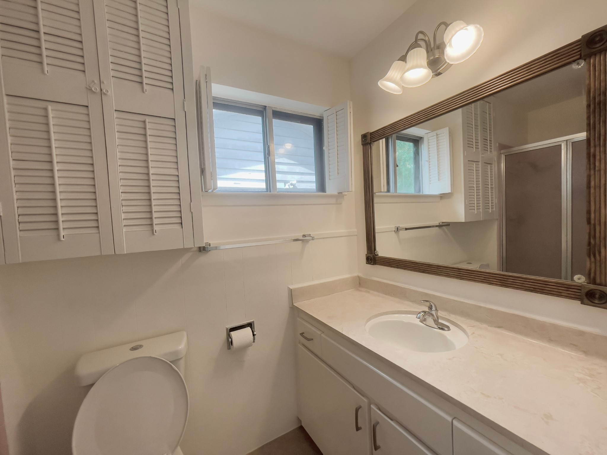 7710 Romney Road Houston, TX 77036 - Photo 12 of 31 a bathroom with a sink and a toilet