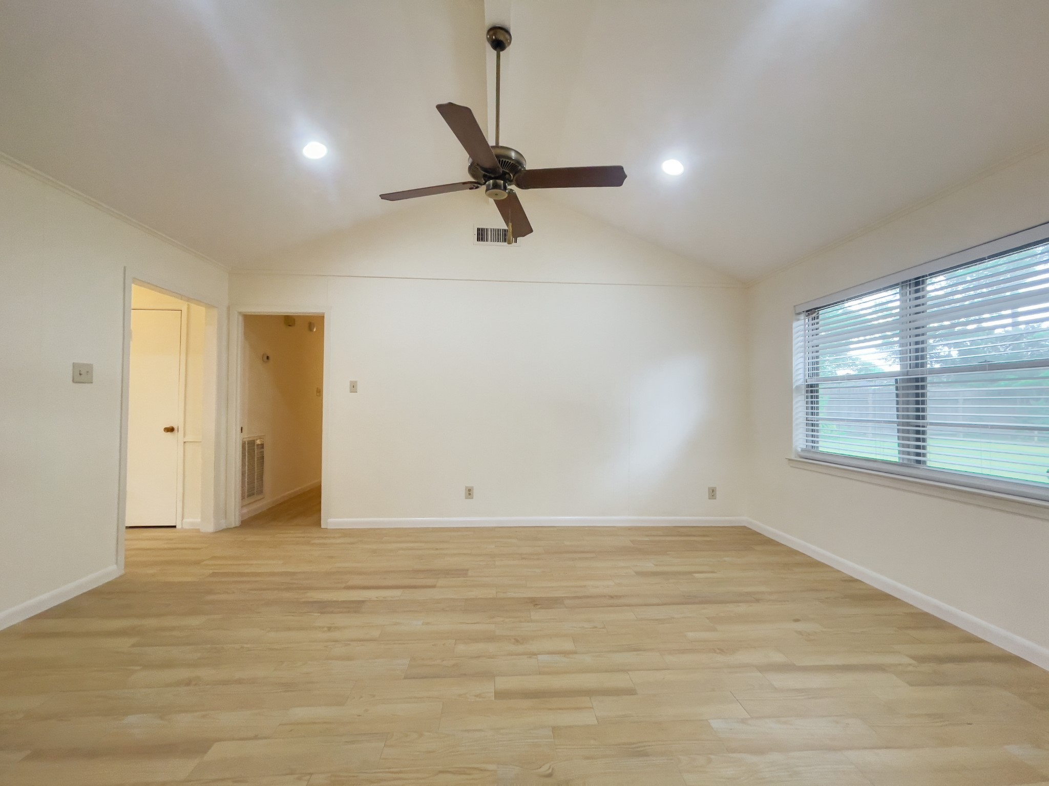 7710 Romney Road Houston, TX 77036 - Photo 20 of 31 a view of an empty room with a window
