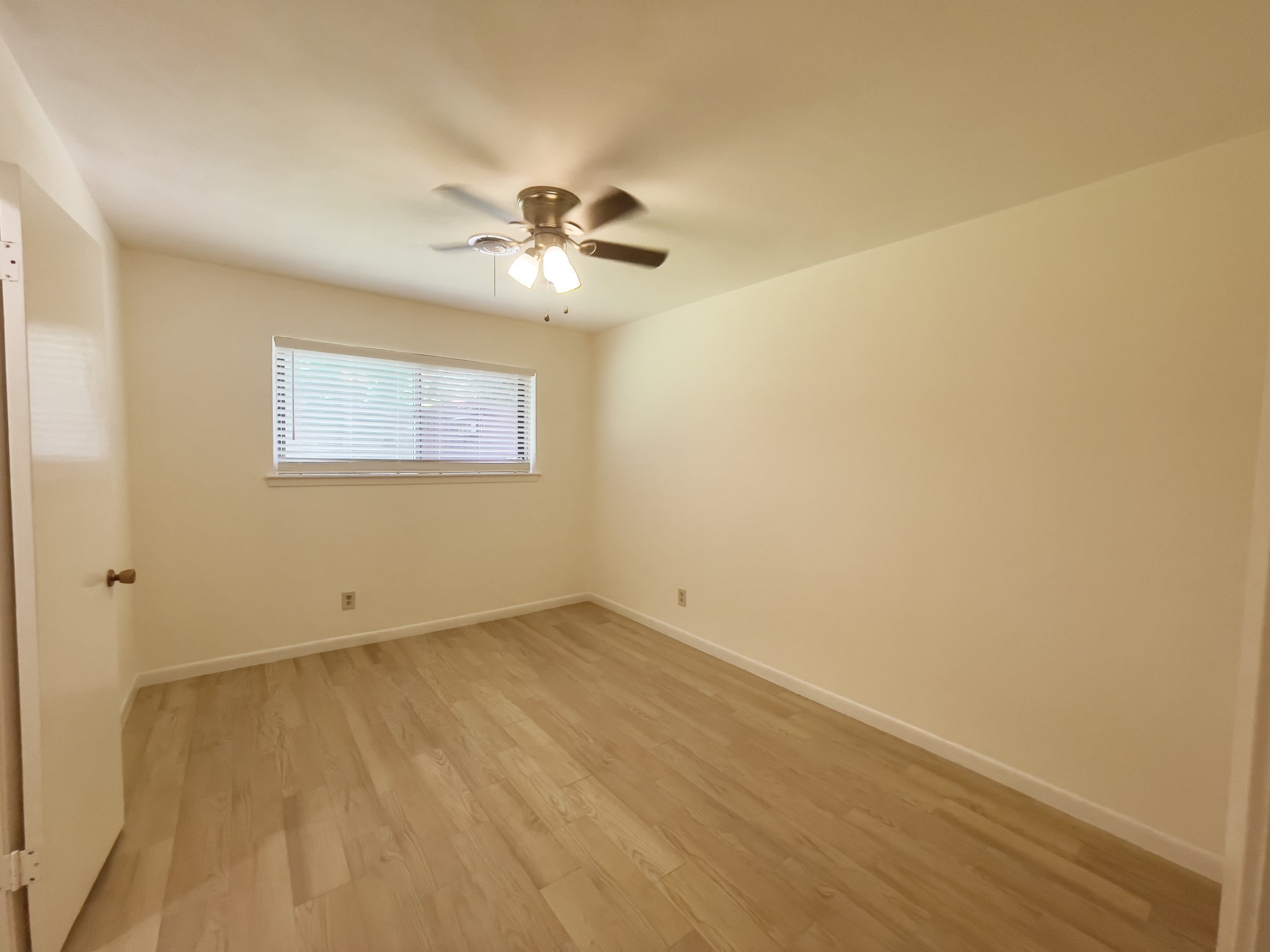 7710 Romney Road Houston, TX 77036 - Photo 22 of 31 a view of an empty room with a window