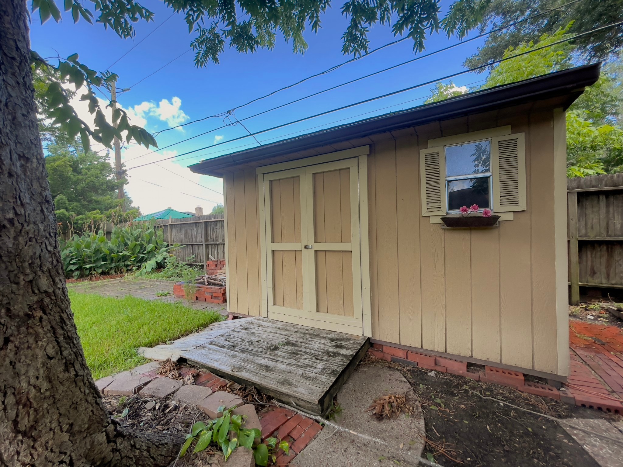 7710 Romney Road Houston, TX 77036 - Photo 27 of 31 a front view of a house with garden
