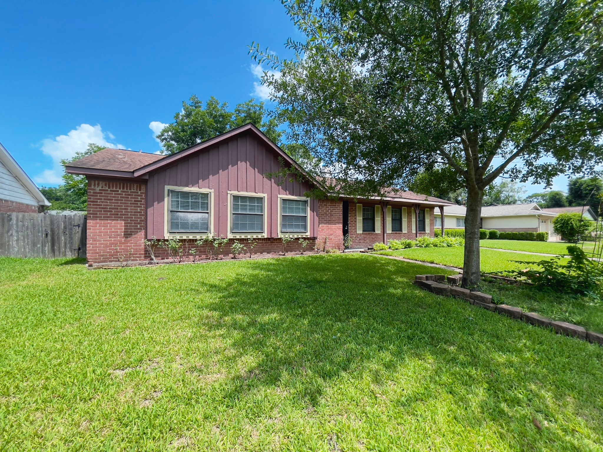 7710 Romney Road Houston, TX 77036 - Photo 31 of 31 a front view of a house with a yard
